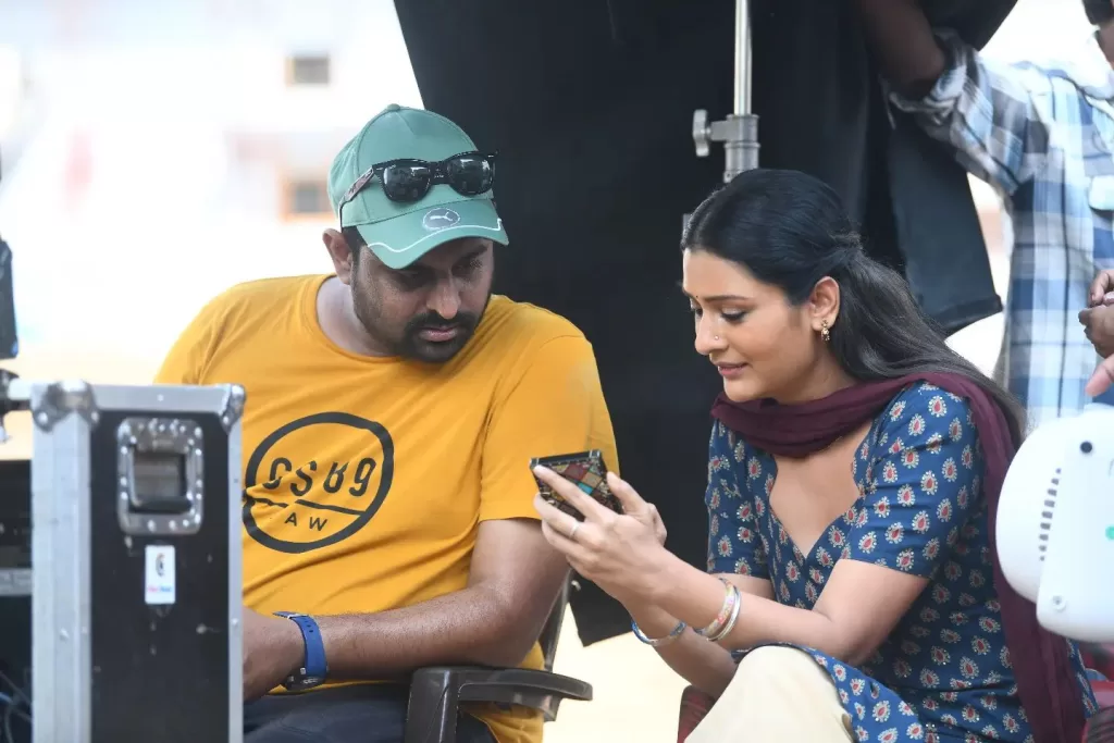 Director Ajay Bhoopathi and the Telegu Actress Payal Rajput seen chatting on the sets of movie Mangalvaaram. 