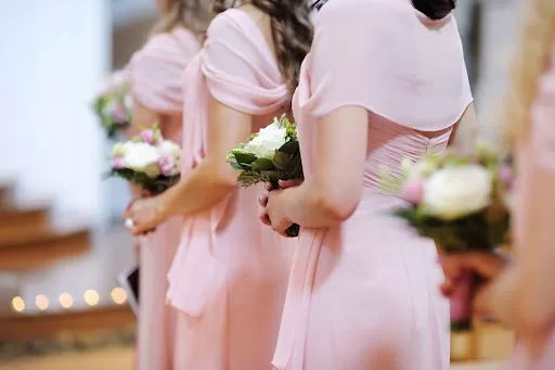 bridesmaids with bouquet at wedding