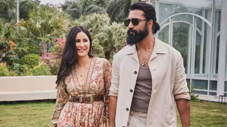 Couple walking in a garden.