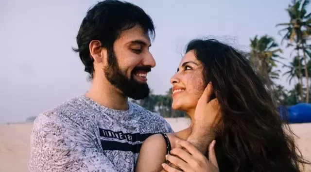Avika and Milind enjoying a beach sunset together.